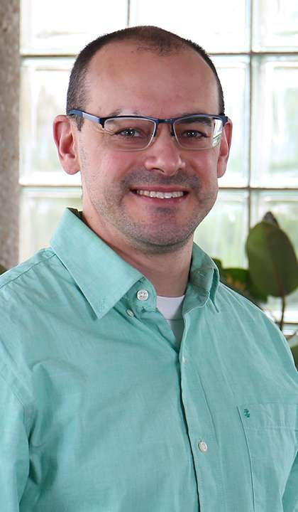 Color photograph of TGI Associate Travis Loux